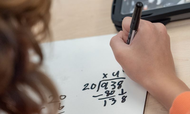 A student works through a math equation Wednesday, Feb. 11, 2026, inside the classroom of Crystal Lembke, a fifth grade teacher at Washington Elementary School in Valparaiso, Indiana.