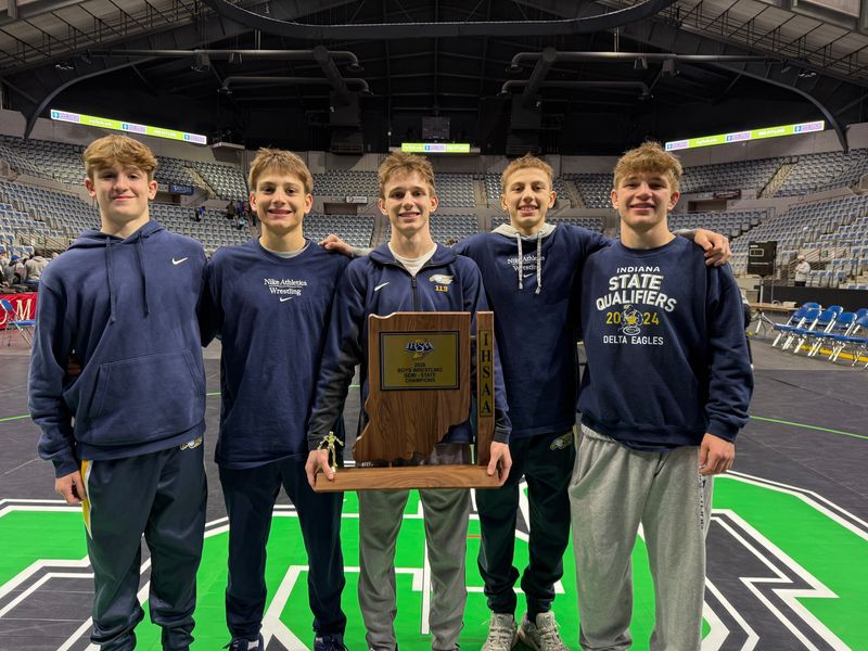 Delta wrestlers, left to right: sophomore Reed Wicker, junior Jensen Boyd, senior Kaid Jackson, freshman Karson Kahalekomo and junior Sam Mosier celebrate their IHSAA semi-state championship at Allen County War Memorial Coliseum in Fort Wayne on Saturday, Feb. 14, 2026.