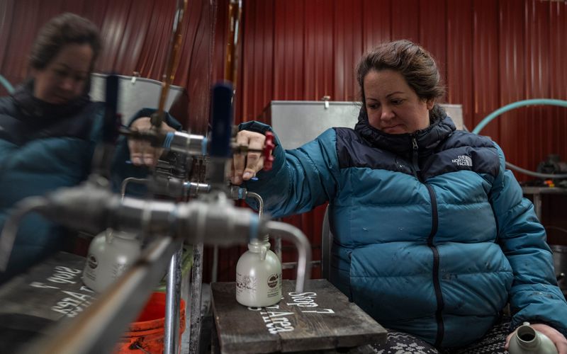 Emily Blackman pours maple syrup to be bottled on Sunday, Feb. 8, 2026, at LM Sugarbush in Salem.