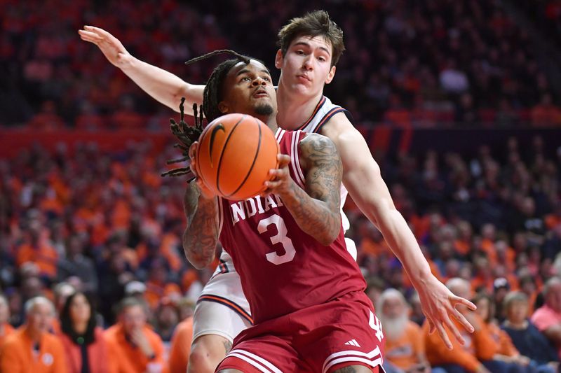 Feb 15, 2026; Champaign, Illinois, USA; Indiana Hoosiers guard Lamar Wilkerson (3) keeps the ball from Illinois Fighting Illini forward David Mirkovic (0) during the second half at State Farm Center. Mandatory Credit: Ron Johnson-Imagn Images