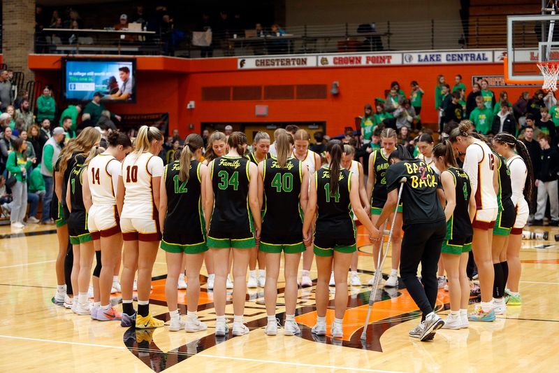 McCutcheon and Northridge partake in a postgame prayer together after an IHSAA Class 4A girls basketball semi-state semifinal game Saturday, Feb. 21, 2026, at LaPorte High School in La Porte.