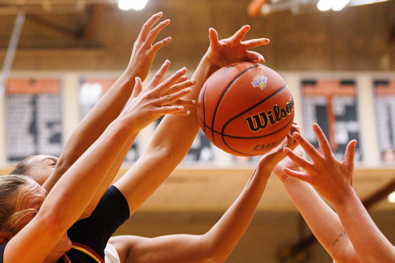 McCutcheon and Norwell fight for possession of the ball during an IHSAA girls basketball semi-state championship game between Norwell and McCutcheon at LaPorte High School on Saturday, Feb. 21, 2026, in LaPorte.