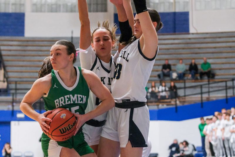 Bremen guard Emma Kincaid is stonewalled by two Oak Hill defenders during the Class 2A semi state matchup between Bremen and Oak Hill on Feb. 21, 2026 at the Everett N. Case Arena in Frankfort, IN.