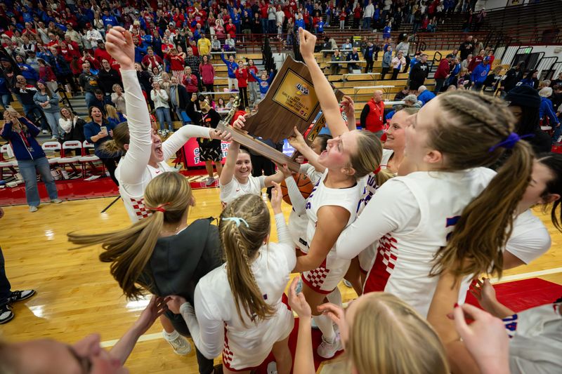 Roncalli High School players celebrate after winning an IHSAA Class 3A girls basketball semi-state championship game against Jennings County High School, Saturday, Feb. 21, 2026, at Southport Fieldhouse in Indianapolis. Roncalli High School won 50-47.
