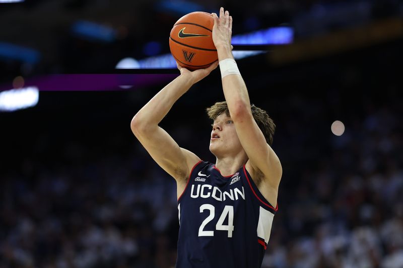 Feb 21, 2026; Philadelphia, Pennsylvania, USA; UConn Huskies guard Braylon Mullins (24) shoots against the Villanova Wildcats during the first half at Xfinity Mobile Arena. Mandatory Credit: Bill Streicher-Imagn Images