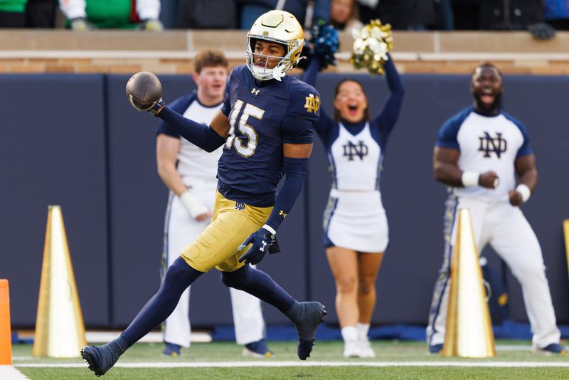 Notre Dame cornerback Leonard Moore returns an interception for a touchdown in the first half of a NCAA football game against Syracuse at Notre Dame Stadium on Saturday, Nov. 22, 2025, in South Bend.