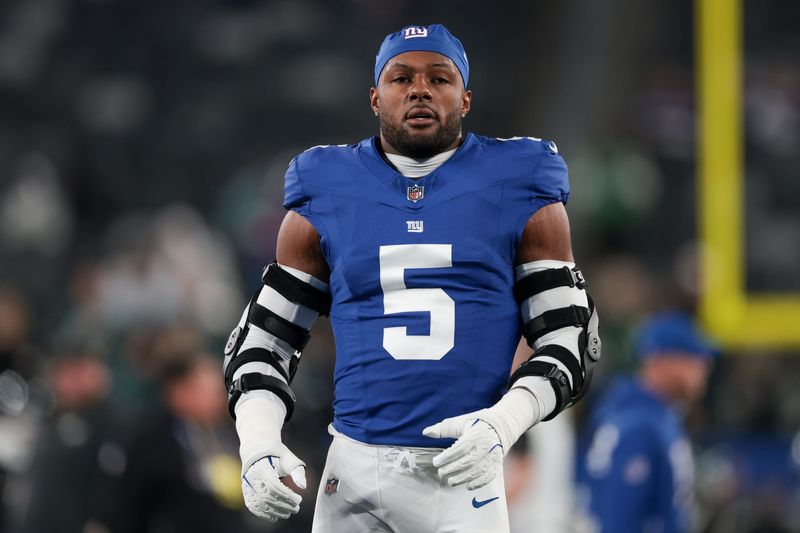 Oct 9, 2025; East Rutherford, New Jersey, USA; (Editors Notes: Caption Correction) New York Giants linebacker Kayvon Thibodeaux (5) looks on during warmups before the game against the Philadelphia Eagles at MetLife Stadium. Mandatory Credit: Vincent Carchietta-Imagn Images