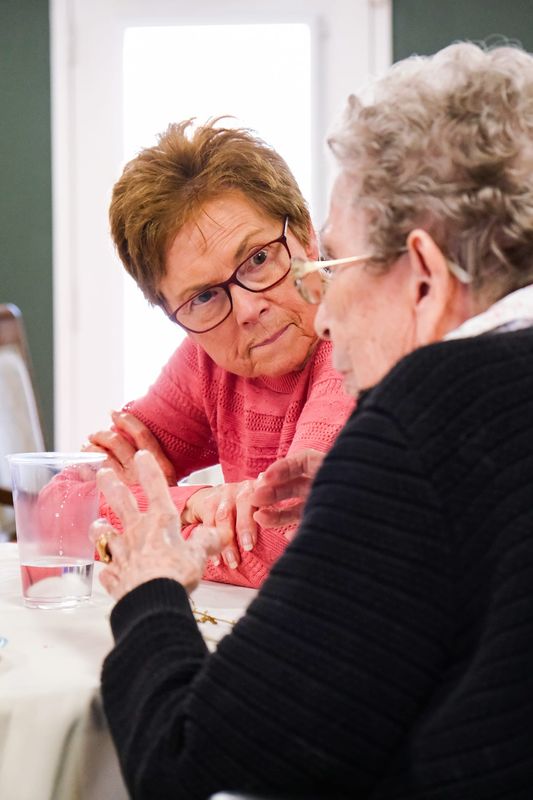 Cheryl Weaver listens intently to a story from another Lafayette senior at the Creative Connections event on Feb. 25, 2026, at Traditions of Lafayette.