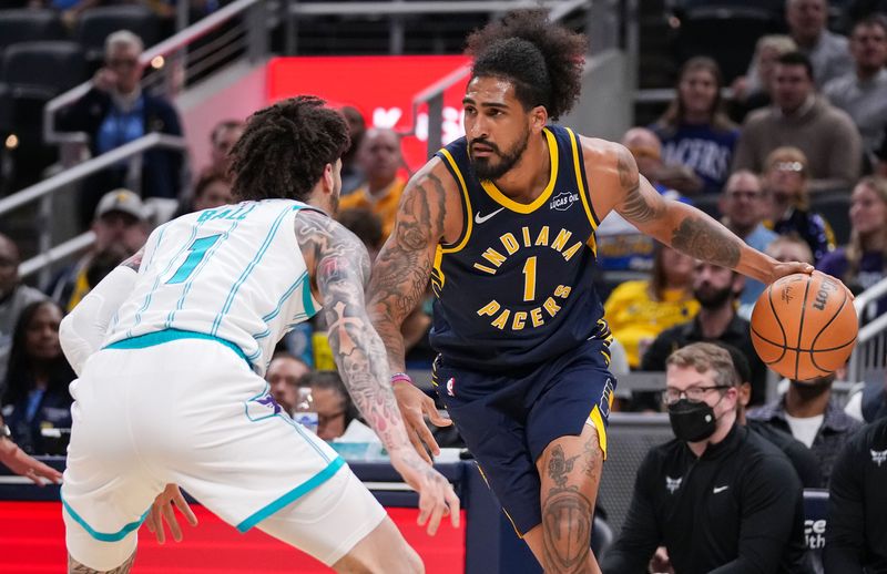 Indiana Pacers forward Obi Toppin (1) rushes up the court against Charlotte Hornets guard LaMelo Ball (1) on Thursday, Feb. 26, 2026, during the game at Gainbridge Fieldhouse in Indianapolis.