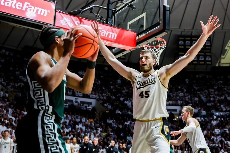 Oscar Cluff defends the inbound pass from Michigan State's Jeremy Fears Jr. during the first half of Purdue's game against Michigan State on Feb. 26, 2026, at Mackey Arena in West Lafayette, IN.