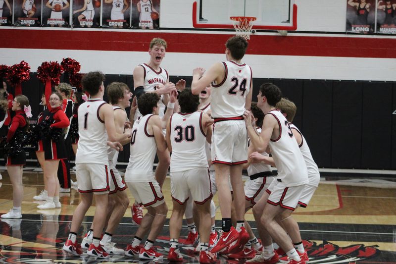 Wapahani boys basketball celebrates a 58-48 victory over Shenandoah on senior night Friday, Feb. 27, 2026.