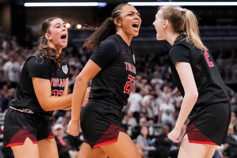Center Grove guard Haley Wagoner (33), Center Grove guard Gracyn Gilliard (22) and Center Grove guard Lillia Tapak (2) celebrate Saturday, Feb. 28, 2026, during the Class 4A IHSAA girls state basketball championship game at Gainbridge Fieldhouse in Indianapolis. Center Grove defeated the Norwell Knights, 56-53.