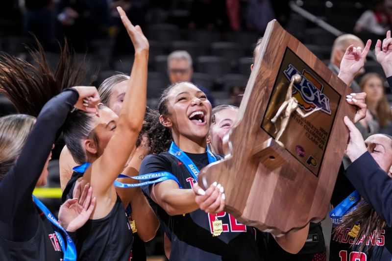 Center Grove celebrates Saturday, Feb. 28, 2026, after winning the Class 4A IHSAA girls state basketball championship game at Gainbridge Fieldhouse in Indianapolis. Center Grove defeated the Norwell Knights, 56-53.
