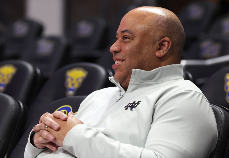 Feb 21, 2026; Pittsburgh, Pennsylvania, USA; Notre Dame Fighting Irish head coach Micah Shrewsberry looks on as his team warms up before the game against the Pittsburgh Panthers at the Petersen Events Center. Mandatory Credit: Charles LeClaire-Imagn Images
