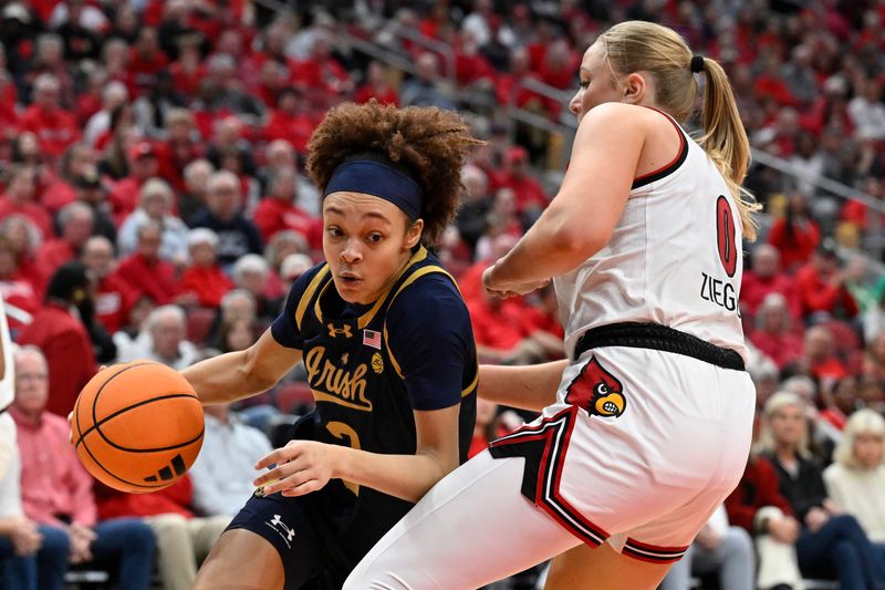 Mar 1, 2026; Louisville, Kentucky, USA; Notre Dame Fighting Irish guard Hannah Hidalgo (3) dribbles against Louisville Cardinals forward Laura Ziegler (0) during the second half at KFC Yum! Center. Notre Dame defeated Louisville 65-62. Mandatory Credit: Jamie Rhodes-Imagn Images