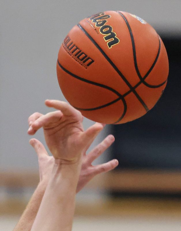 Zionsville Eagles guard Camden Moore (45) and Noblesville Millers center Evan Magsamen (22) go up for the ball at tipoff Tuesday, March 3, 2026, during an IHSAA boys basketball sectionals matchup at Noblesville High School in Noblesville, Ind.