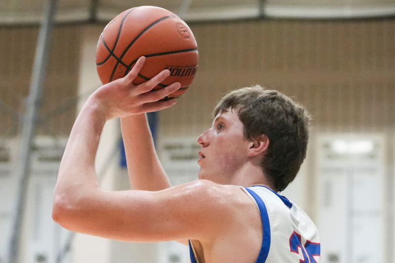 Hamilton Southeastern Royals forward Landon Osswald (35) attempts a basket Tuesday, March 3, 2026, during an IHSAA boys basketball sectionals matchup at Noblesville High School in Noblesville, Ind.
