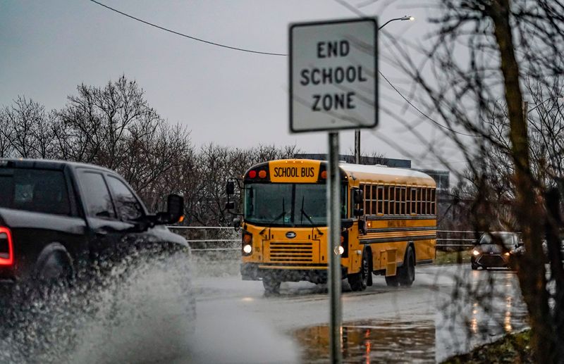 Vehicles hit puddles near Belmont Beach on Tuesday, March 3, 2026, in Indianapolis.
