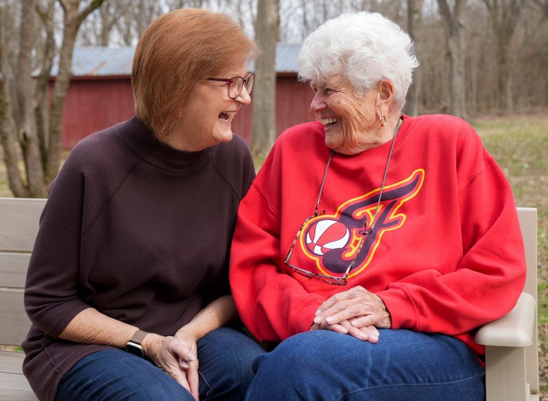 Fran Robinson (left) and Lin Dunn share a laugh as they get their photo taken in the backyard of their home Wednesday, Feb. 18, 2026, in Dresden, Tenn. Dunn’s mother and grandparents owned the home that she inherited and now shares with Robinson.