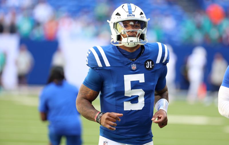 Indianapolis Colts quarterback Anthony Richardson Sr. (5) warms up before a game against the Miami Dolphins at Lucas Oil Stadium.
