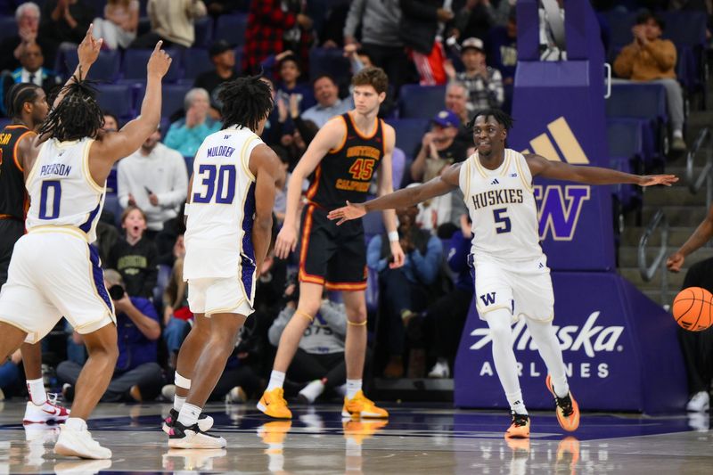 Mar 4, 2026; Seattle, Washington, USA; Washington Huskies guard Zoom Diallo (5) celebrates after scoring a basket against the Southern California Trojans during the second half at Alaska Airlines Arena at Hec Edmundson Pavilion. Mandatory Credit: Steven Bisig-Imagn Images