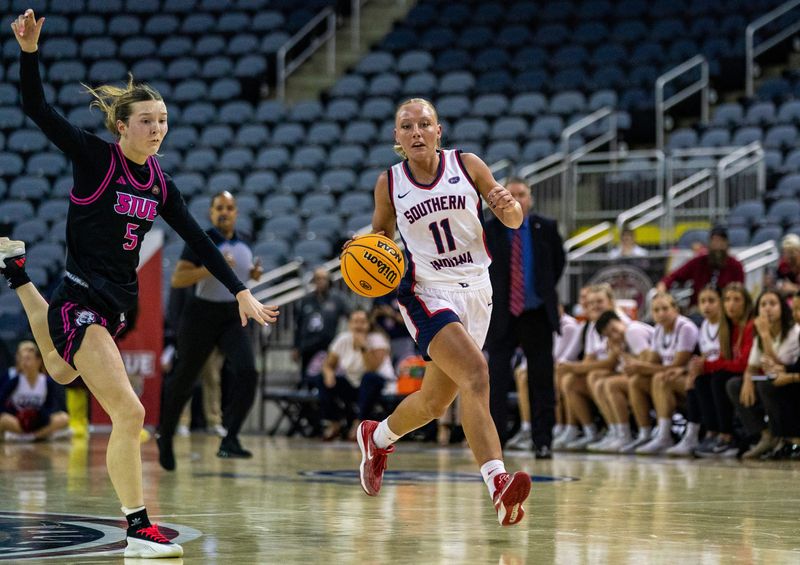 Southern Indiana's Ali Saunders (11) drives as the University of Southern Indiana Screaming Eagles play the SIU-Edwardsville Cougars during the quarterfinal round of the 2026 Ohio Valley Conference Women's Basketball championship games at Ford Center Thursday, March 5, 2026.