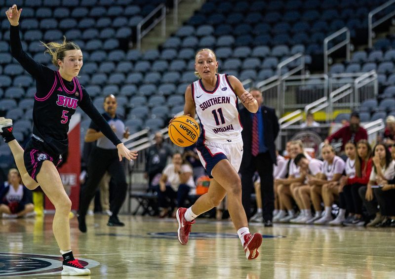 Southern Indiana's Ali Saunders (11) drives as the University of Southern Indiana Screaming Eagles play the SIU-Edwardsville Cougars during the quarterfinal round of the 2026 Ohio Valley Conference Women's Basketball championship games at Ford Center Thursday, March 5, 2026.