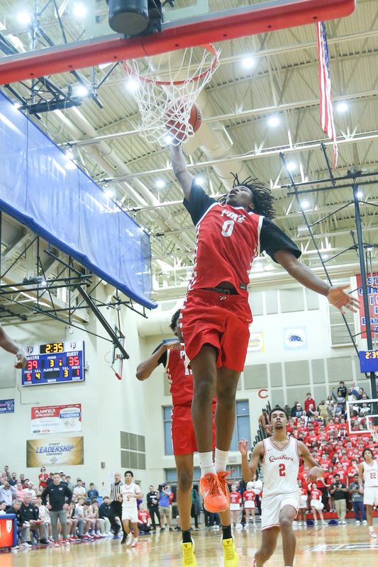 Pikes Jahari Miller (0) drives in for a shot as Plainfield took on Pike High School in the IHSAA S11 Class 4A Boys Basketball State Tournament Semifinals, Mar 6, 2026; Plainfield, IN; at Plainfield High School.