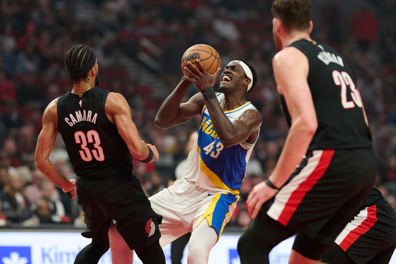 Mar 8, 2026; Portland, Oregon, USA; Indiana Pacers forward Pascal Siakam (43) is fouled as he drives to the basket during the first half against Portland Trail Blazers forward Toumani Camara (33) at Moda Center. Mandatory Credit: Troy Wayrynen-Imagn Images