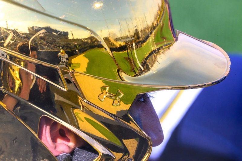 Frank Eck Stadium is reflected in the helmet of Notre Dameâ€™s Tito Flores (7) in the first inning against Western Michigan Tuesday, March 19, 2024, at Frank Eck Stadium.