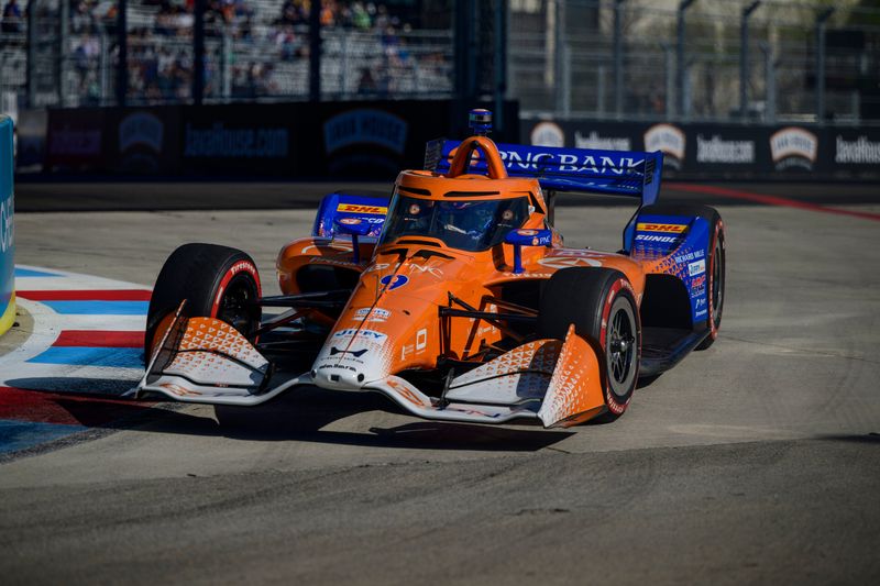 Mar 13, 2026; Arlington, Texas, USA; Chip Ganassi Racing driver Scott Dixon (9) drives by Texas Rangers Globe Life Field during practice for the 2026 Streets of Arlington IndyCar race. Mandatory Credit: Jerome Miron-Imagn Images