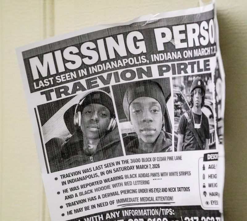Missing posters for Traevion Pirtle, missing since March 7, 2026, hang on a home located at 3622 Cedar Pine Place, on Saturday, March 14, 2026, in Indianapolis.near the Fervent Prayer Church (10512 E 38th St.) on Saturday, March 14, 2026, in Indianapolis.