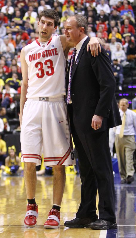 Ohio State guard Jon Diebler puts his arm around basketball coach Thad Matta during a Big Ten Tournament game at Conseco Fieldhouse on March 12, 2011.