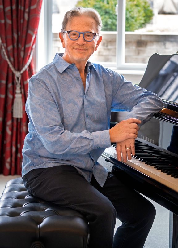 Indianapolis Symphony Orchestra Principal Pops Conductor Jack Everly sits at the piano in his home Monday, March 2, 2026 in Zionsville. He has played the piano his whole life and learned young that he had an ear for music.