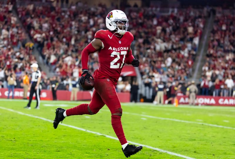 Nov 23, 2025; Glendale, Arizona, USA; Arizona Cardinals linebacker Akeem Davis-Gaither (27) celebrates an interception against the Jacksonville Jaguars at State Farm Stadium. Mandatory Credit: Mark J. Rebilas-Imagn Images