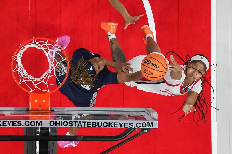Ohio State Buckeyes guard Chance Gray (2) shoots over Howard Bison guard Zoe Stewart (23) during the first round of the NCAA women's basketball tournament at the Jerome Schottenstein Center in Columbus on March 21, 2026.