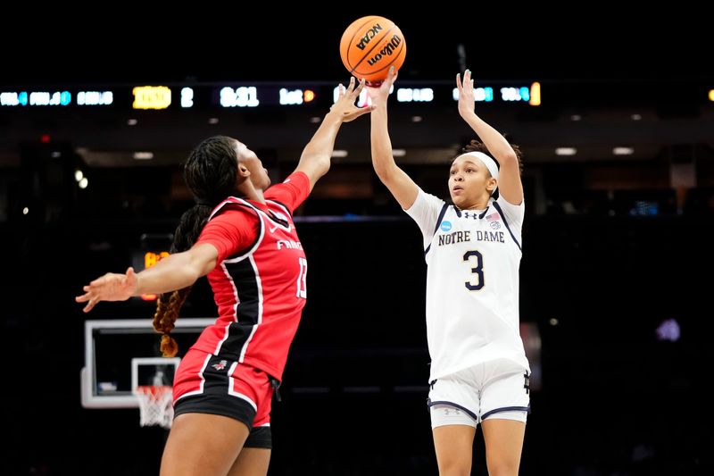 Notre Dame Fighting Irish guard Hannah Hidalgo (3) shoots over Fairfield Stags forward Cyanne Coe (13) during the first round of the NCAA women's basketball tournament at Ohio State's Schottenstein Center in Columbus on March 21, 2026.