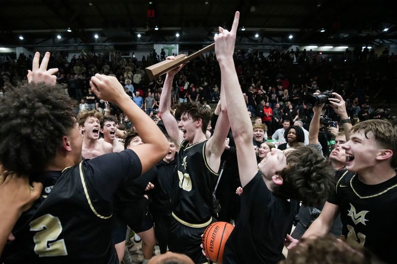 The Mt. Vernon Marauders celebrate Saturday, March 21, 2026, after winning a Class 4A semistate championship game at New Castle Fieldhouse in New Castle, Ind. The Mt. Vernon Marauders defeated the New Albany Bulldogs, 77-69.