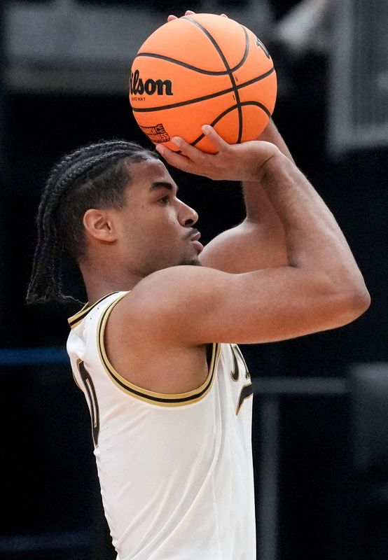 Purdue Boilermakers guard C.J. Cox (0) scores a three-point field goal against the Miami Hurricanes during a NCAA Tournament second round game Sunday, March 22, 2026, at Enterprise Center in St. Louis.
