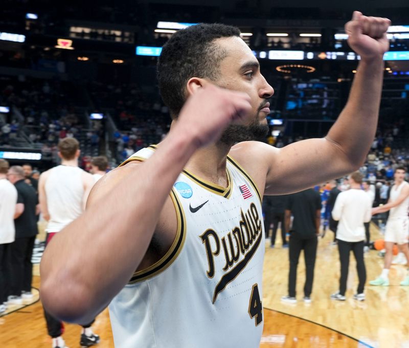 Purdue Boilermakers forward Trey Kaufman-Renn (4) reacts as he comes off the court following a NCAA Tournament second round game against the Miami Hurricanes on Sunday, March 22, 2026, at Enterprise Center in St. Louis. Purdue defeated Miami 79-69.