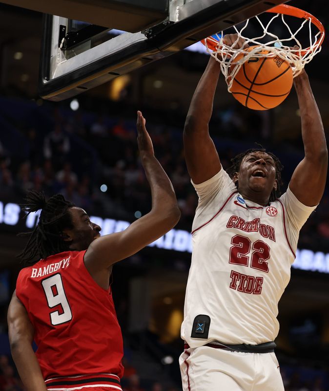 Mar 22, 2026; Tampa, FL, USA; Alabama Crimson Tide forward Aiden Sherrell (22) dunks past Texas Tech Red Raiders forward Luke Bamgboye (9) in the first half during a second round game of the men's 2026 NCAA Tournament at Benchmark International Arena. Mandatory Credit: Matt Pendleton-Imagn Images