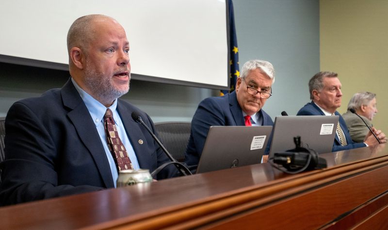 IURC Commissioner Anthony Swinger, left, questions AES representatives during the IURC investigative hearing on energy affordability Tuesday, March 24, 2026.