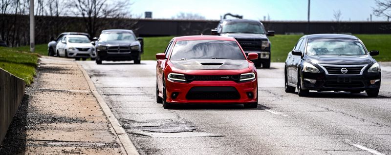 Vehicles traverse N. Keystone Ave., after potholes were filled on Wednesday, March 25, 2026, in Indianapolis.