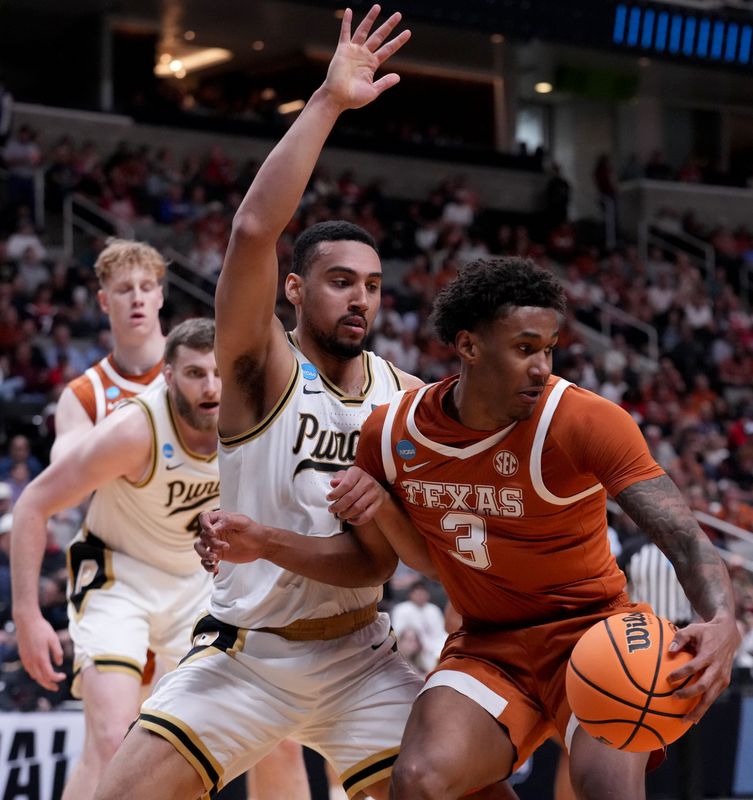 Purdue Boilermakers forward Trey Kaufman-Renn (4) defends against Texas Longhorns forward Dailyn Swain (3) on Thursday, March 26, 2026, during a Sweet 16 game at SAP Center in San Jose, Calif.