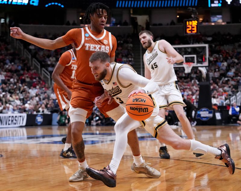 Purdue Boilermakers guard Braden Smith (3) drives past Texas Longhorns guard Simeon Wilcher (7) on Thursday, March 26, 2026, during a Sweet 16 game at SAP Center in San Jose, Calif.