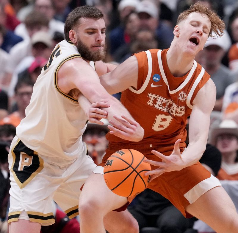 Purdue Boilermakers center Oscar Cluff (45) defends against Texas Longhorns center Matas Vokietaitis (8) on Thursday, March 26, 2026, during a Sweet 16 game at SAP Center in San Jose, Calif.