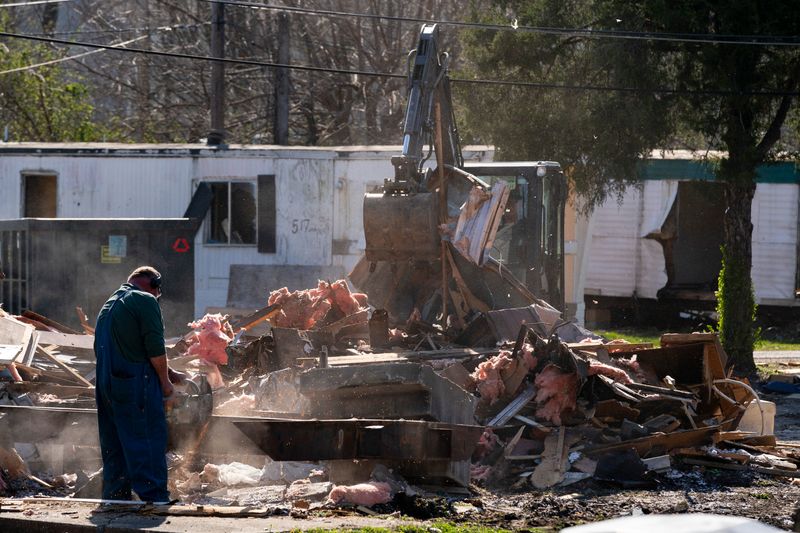 Demolition begins on the fire-destroyed units that were ordered to be razed by the Evansville-Vanderburgh County Building Commissioner Johnny McCalister in the mobile home park off Oak Hill Road in Evansville, Ind., Thursday, March 19, 2026.