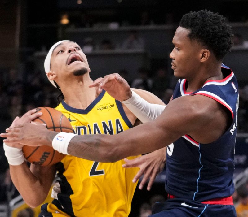 LA Clippers guard Bennedict Mathurin (9) guards Indiana Pacers guard Andrew Nembhard (2) on Friday, March 27, 2026, during the first half of a game at Gainbridge Fieldhouse in Indianapolis.