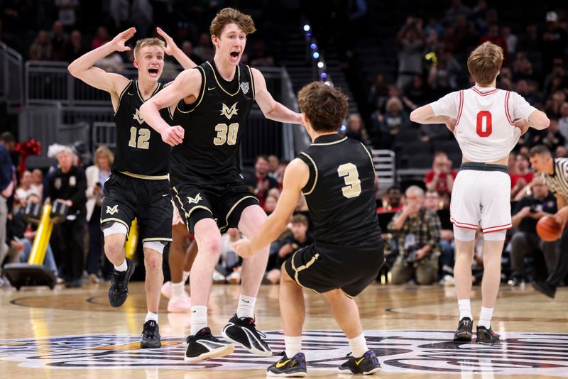 Mt. Vernon Marauders guard Luke Ertel (12), Mt. Vernon Marauders forward Max Vise (30) and Mt. Vernon Marauders guard Ben Schaeffer (3) celebrate Saturday, March 28, 2026, after winning the Class 4A IHSAA boys state basketball championship game at Gainbridge Fieldhouse in Indianapolis. The Mt. Vernon Marauders defeated the Crown Point Bulldogs, 52-50.