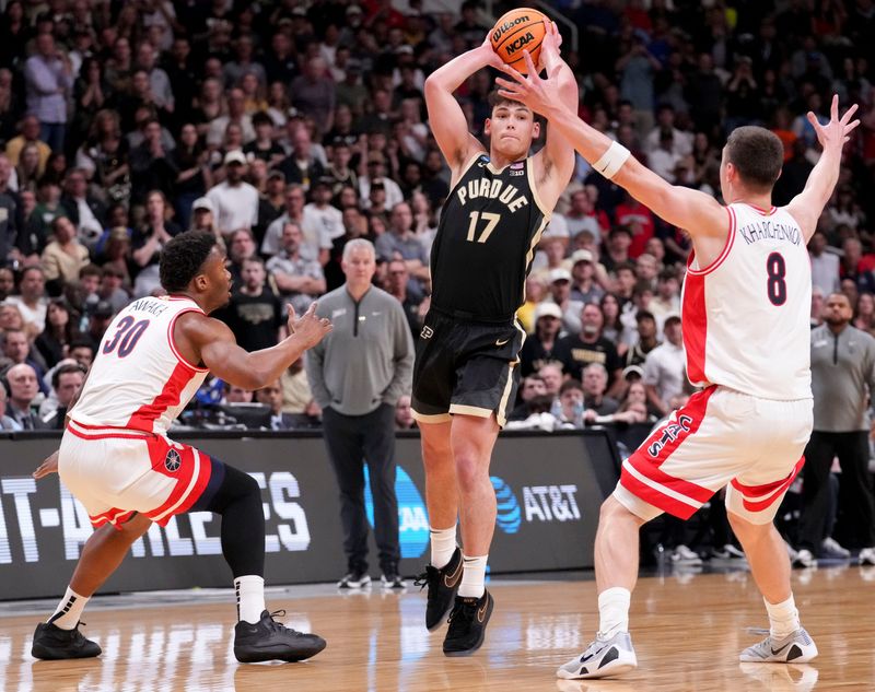 Arizona Wildcats forward Tobe Awaka (30) and forward Ivan Kharchenkov (8) defend Purdue Boilermakers guard Omer Mayer (17) as he looks to pass the ball during a NCAA Tournament game Saturday, March 28, 2026 at SAP Center in San Jose, Calif. Purdue fell to Arizona 79-64.